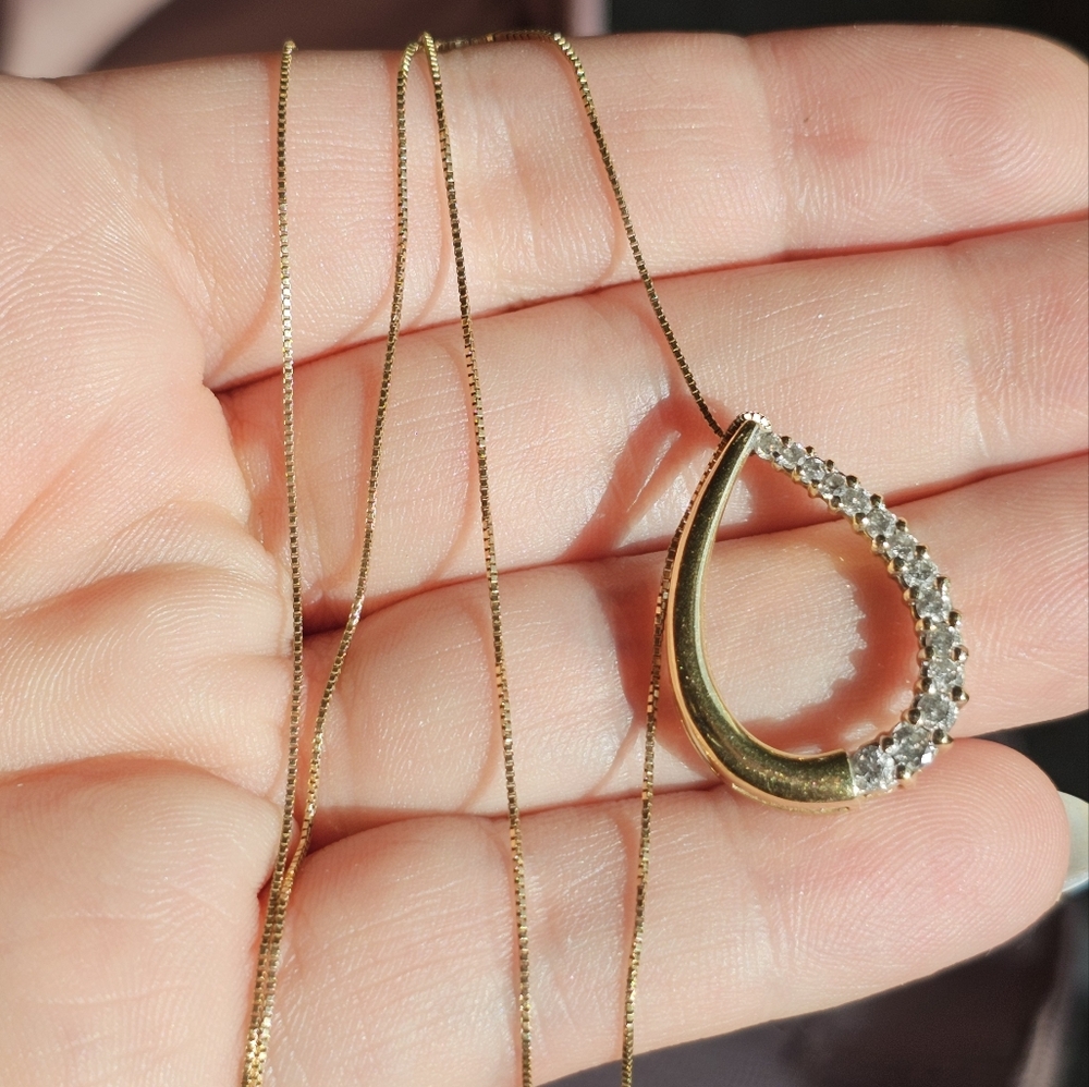 14k diamond necklace! Stamped 14k on the back of the pendant and the chain clasp